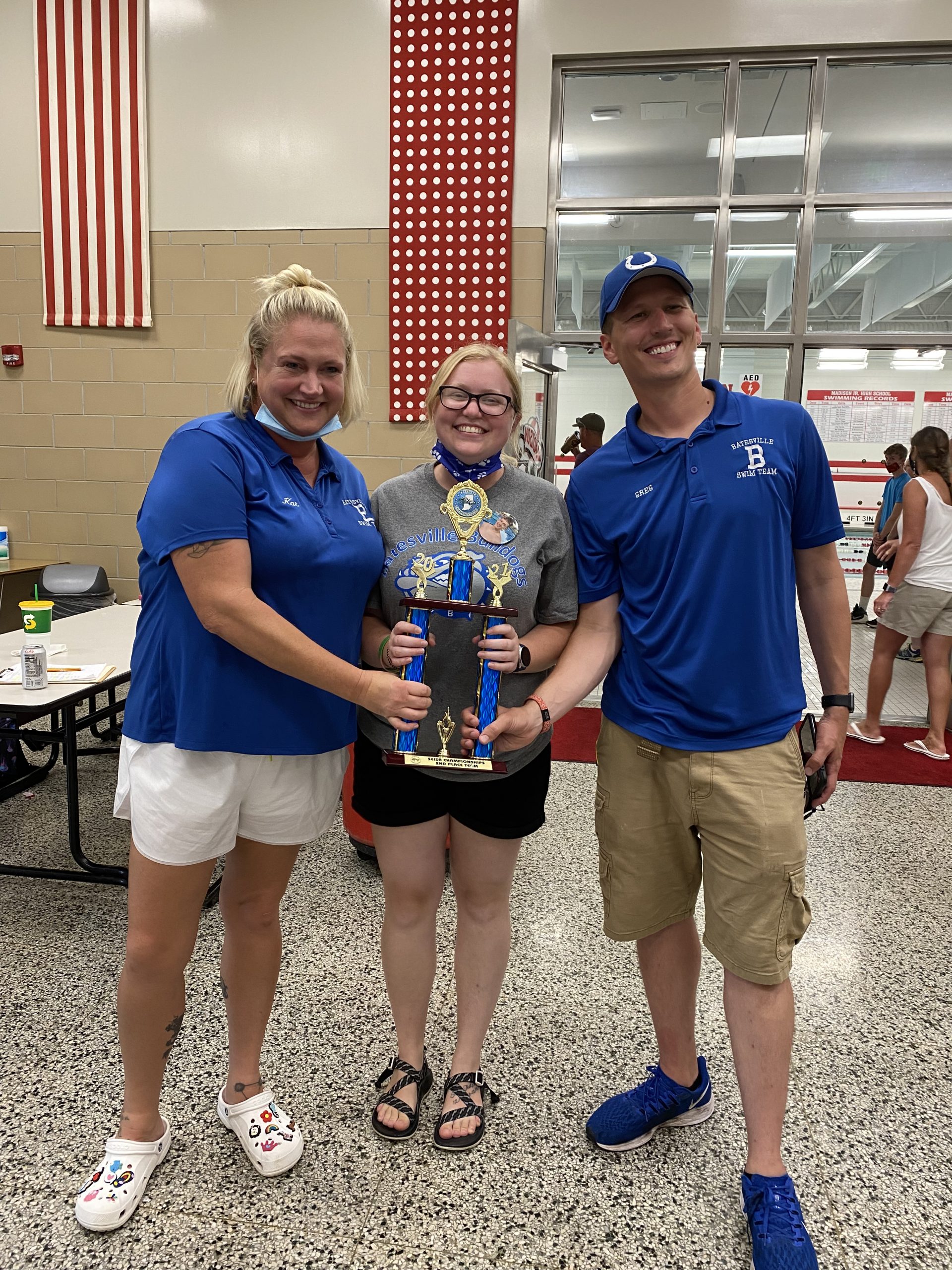 Batesville Swim Team Coaches, Kat Bryan, Sidney Howard and Greg McMullen holding SEISA second place trophy